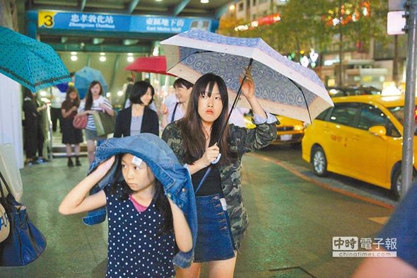 台湾降下首波梅雨 气温随雨势骤降8度（图）